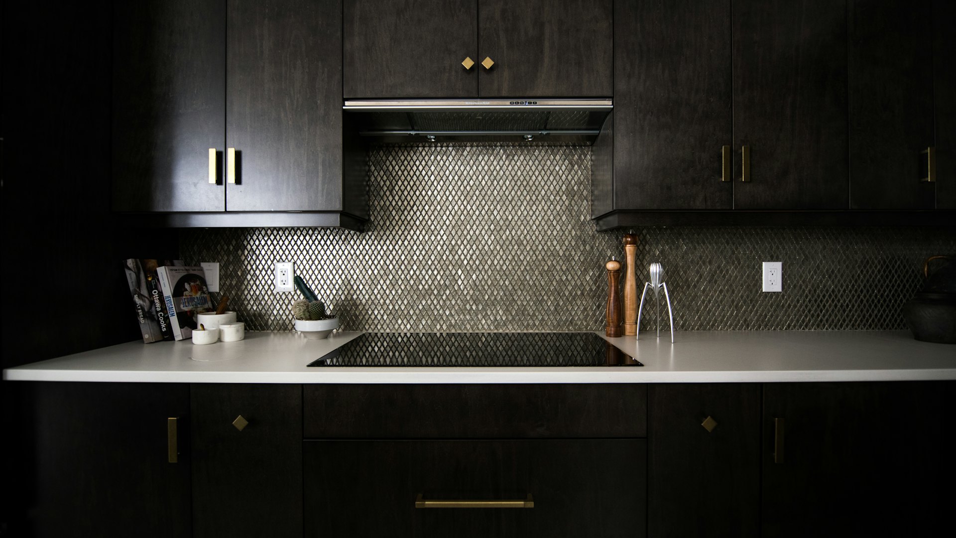 A kitchen counter and tile backsplash