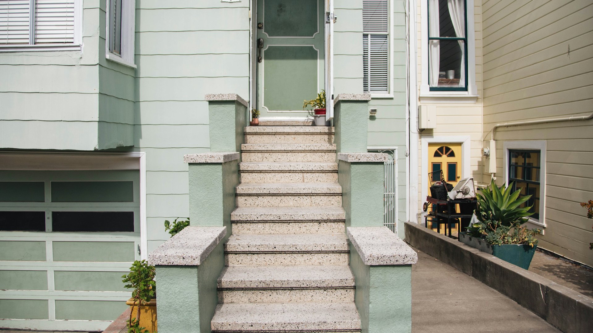 Concrete front steps leading to a house
