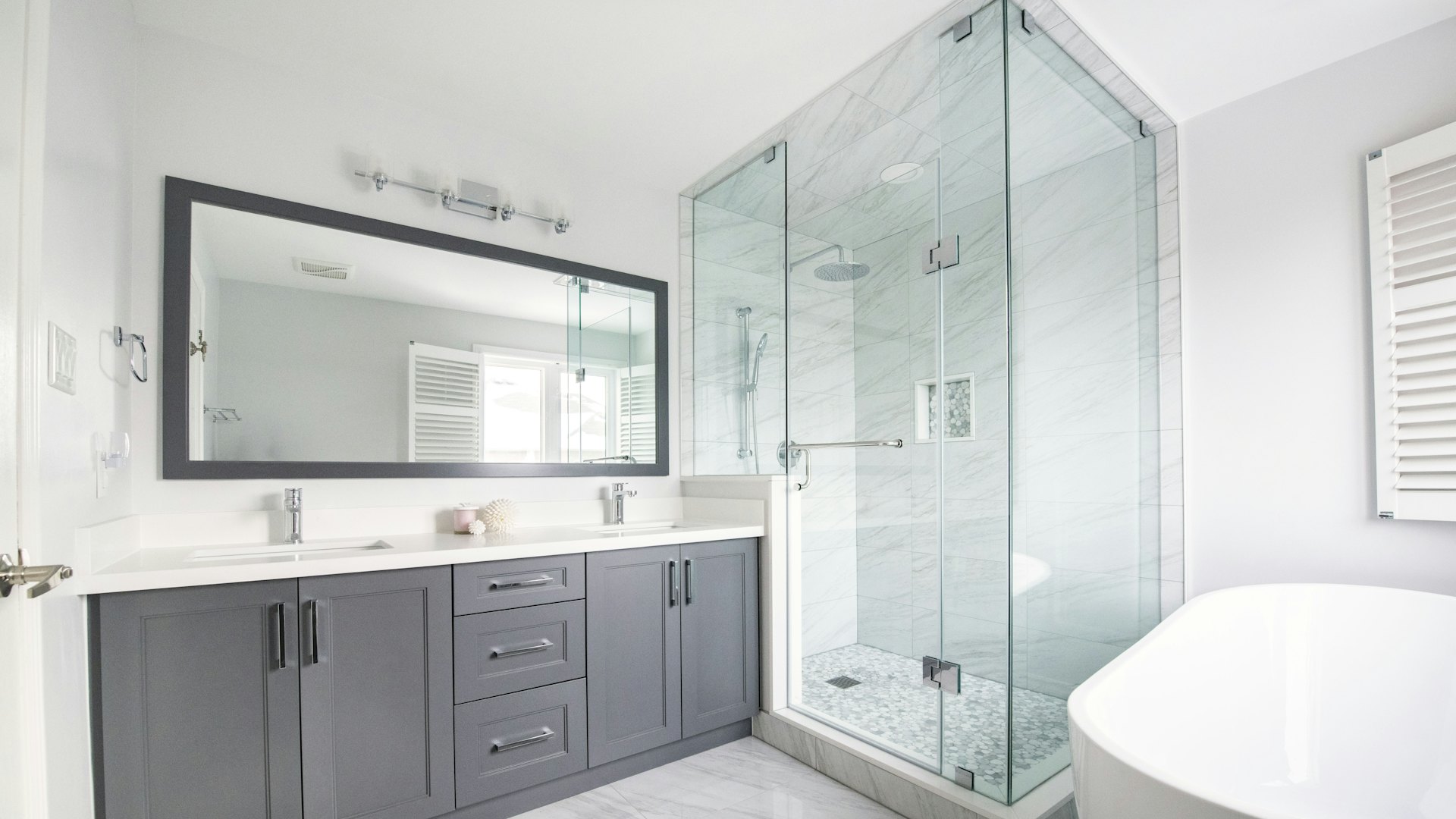 A glass shower door in a bathroom